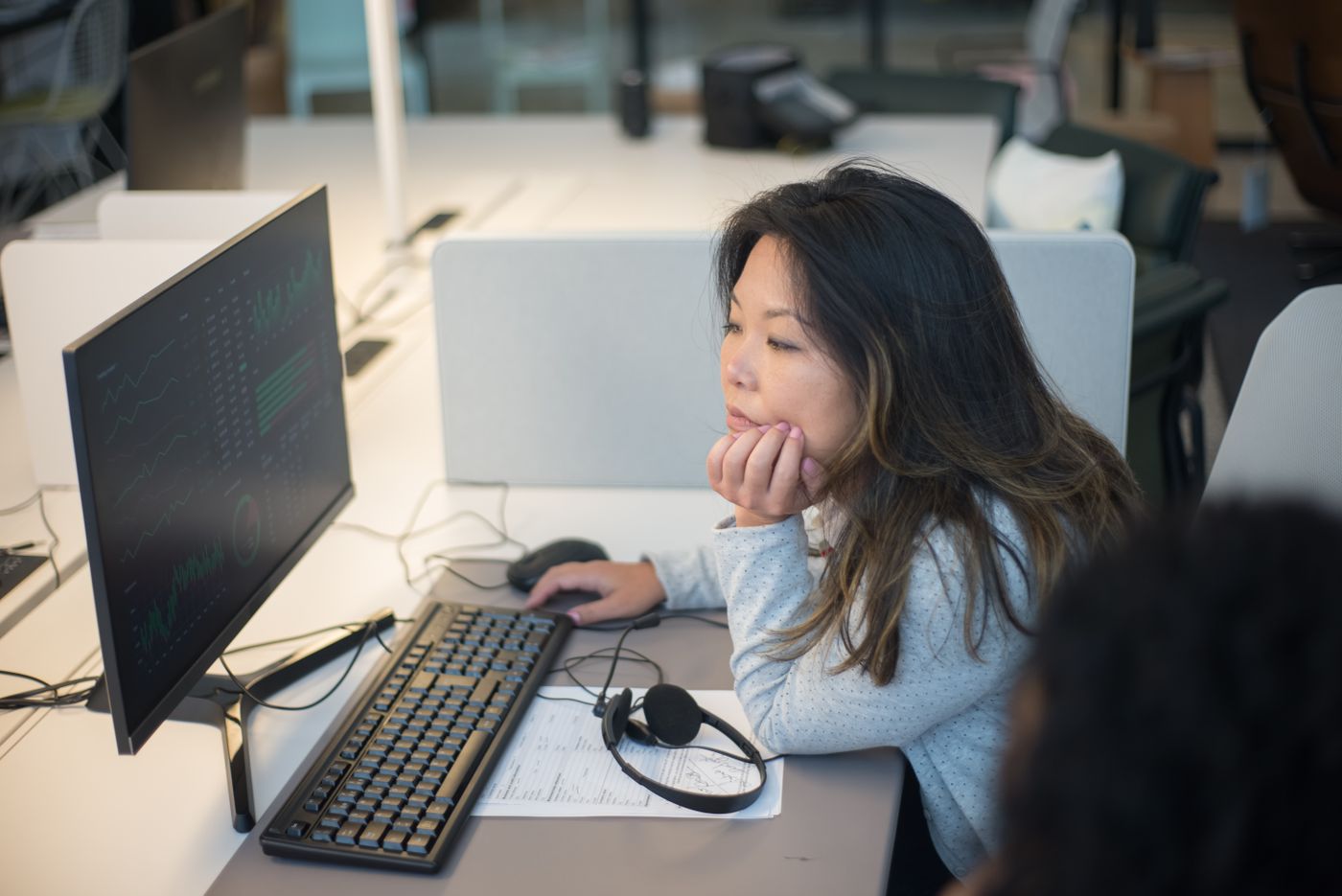 A dispatcher working at a desk computer